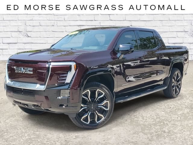 2025 GMC Sierra EV Extended Range Denali in Dark Ember Tintcoat — front three-quarter view